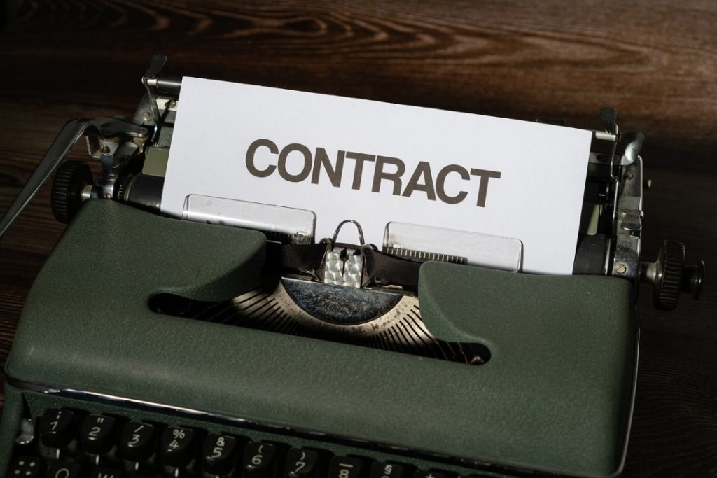 Typing a contract with a typewriter